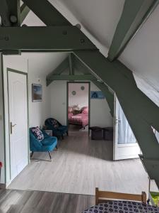 a room with a bed and a mirror at Appartement pour 2 personnes in Annequin