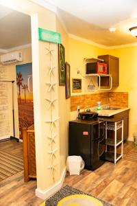 a kitchen with a sink and a counter in a room at Cocoplum Rest N Hideaway #1 in Nassau