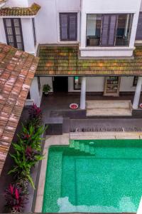 an aerial view of a house with a swimming pool at Sol De Goa in Nerul