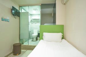 Voodi või voodid majutusasutuse 珀依旅馆 Pop E INN toas