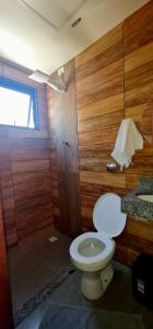 a bathroom with a toilet and a sink at Hotel Platina in Juiz de Fora