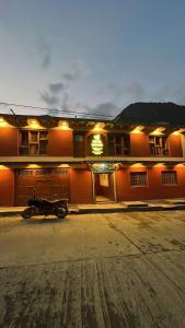 a motorcycle parked in front of a building at Hotel Dancing Yak in Lete