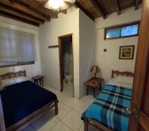 Postel nebo postele na pokoji v ubytování Hostal SoleMare