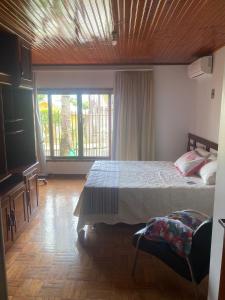 Postel nebo postele na pokoji v ubytování Quarto em Foz do Iguaçu