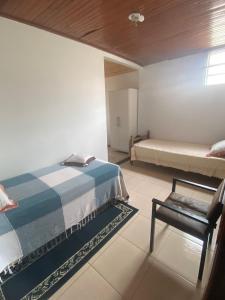 Postel nebo postele na pokoji v ubytování Quarto em Foz do Iguaçu