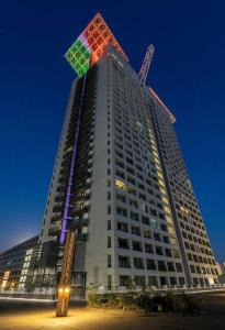 a tall building with a kite on top of it at EuroSky Prestige Apartment ROMA EUR in Rome
