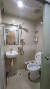 a bathroom with a toilet and a sink at M18 Station 103,107 in Hong Kong
