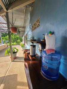 a room with a table and a barrel in a room at The Inn at Punta Mala in Pedasí Town