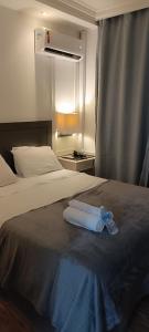 En eller flere senge i et værelse på World Flat Hotel - Vila Olímpia