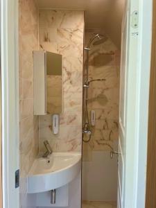 Koupelna v ubytování The Whispering Apple Nordisk Retreat Lejlighed på Fyn