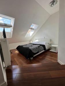 a bedroom with a bed in a attic at Jacuzzi Apartment - Center Zagreb in Zagreb