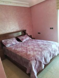 En eller flere senge i et værelse på Résidence alhouda