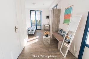 a hallway with stairs and a room with a desk at Hotel Mercedes in Hossegor