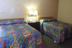 Postel nebo postele na pokoji v ubytování Imperial Motel