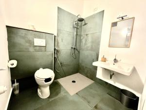 a bathroom with a shower and a toilet and a sink at Country House Nora Rech in SantʼElpidio a Mare