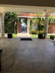 a large concrete patio with a car parked in a driveway at Villas Segovia Hotel Boutique & Suites in Cozumel