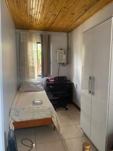 Postel nebo postele na pokoji v ubytování Quarto em Foz do Iguaçu