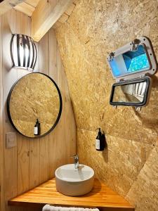 a bathroom with a sink and a mirror at Terrazas de Meliquina in Villa Meliquina