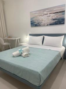 เตียงในห้องที่ Brezza di Stabia Rooms