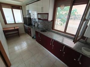 a kitchen with a counter top and some windows at Premium apartment with furniture in Istanbul