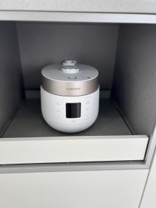 a slow cooker is sitting in a drawer at Almare Woljeong in Jeju