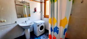 a bathroom with a sink and a toilet and a shower at Taormina al mare Villetta in Mazzeo +51 photos