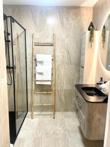 a bathroom with a towel rack and a sink at New apartment at 150m from the beaches Easy check in in Juan-les-Pins