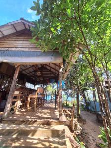 Zahrada ubytování Dragonfly Guesthouse M'Pai Bay + 37 fotografií