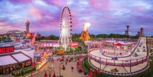 a large amusement park with a large ferris wheel at Stylish Townhome Gem with Several Amenities Just Minutes To The Falls in Niagara Falls