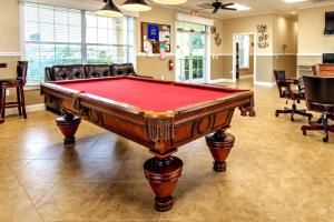 a pool table in the middle of a room at Palm Key Oasis - Close to Attractions in Davenport