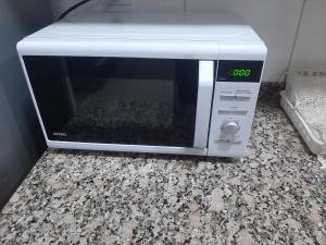 a microwave oven sitting on top of a counter at Suipacha in Mendoza