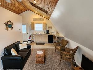 a living room with a couch and chairs and a kitchen at 2310 Central Avenue in North Wildwood