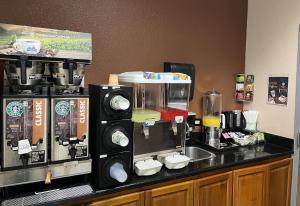 a coffee maker on a counter in a coffee shop at Yosemite Sierra Inn in Oakhurst