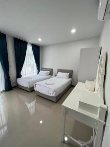 Postel nebo postele na pokoji v ubytování คีรีศิลป์ รีสอร์ท เชียงราย (Khirisin Resort Chiang rai)