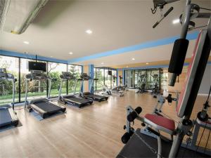 a gym with a bunch of treadmills and machines at Hua Hin First-Hin Nam in Hua Hin