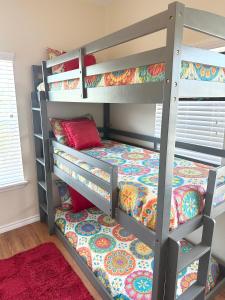 a bunk bed in a room with a bunk bed at Minutes to Riverwalk, Sleeps 12, Pets Welcome! in San Antonio