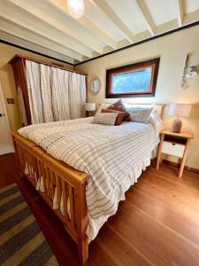a bedroom with a large bed in a room at The Salish Sunset Cabin in Pender Island