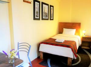 Llit o llits en una habitació de Eco Aventura Hostel Cusco