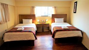 Llit o llits en una habitació de Eco Aventura Hostel Cusco