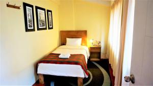 Llit o llits en una habitació de Eco Aventura Hostel Cusco