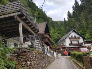 a man walking down a street next to a building at Apartment in Dorfzentrum near Lake in Feld am See