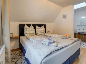 a bedroom with two beds with towels on them at Holiday home in Feld am See with terrace in Feld am See