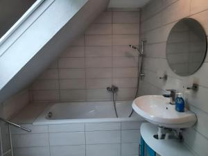 a bathroom with a sink and a bath tub at Property in Burgk in Burgk