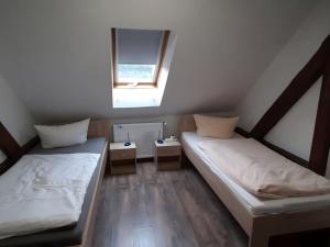 two beds in a small room with a window at Property in Burgk in Burgk