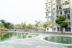 a pool of water in the middle of a city at Miro Resthouse by the Pool in Kajang