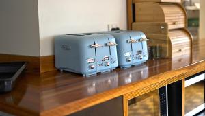 two suitcases sitting on top of a counter at Boali Lodge Thredbo in Thredbo
