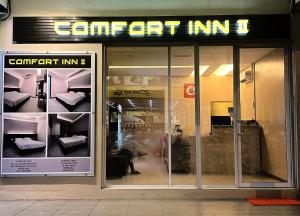 a store front with a sign that reads comfort inn at Comfort Inn Salim in Sibu