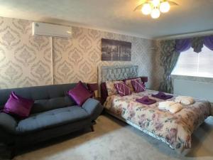 a living room with a couch and a bed at Oakland in Fleetwood