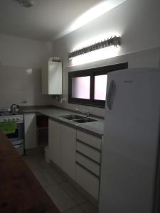 Una cocina o kitchenette en Alta Gracia Home