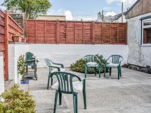 a group of chairs sitting on a patio at Ardencaple No 2 in Castle Douglas